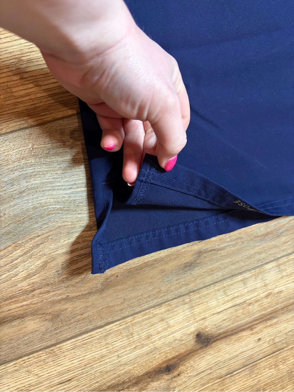 Jaanuu Women's Helia V-Neck Scrub Top in the color Midnight Navy - Picture 5 of 7